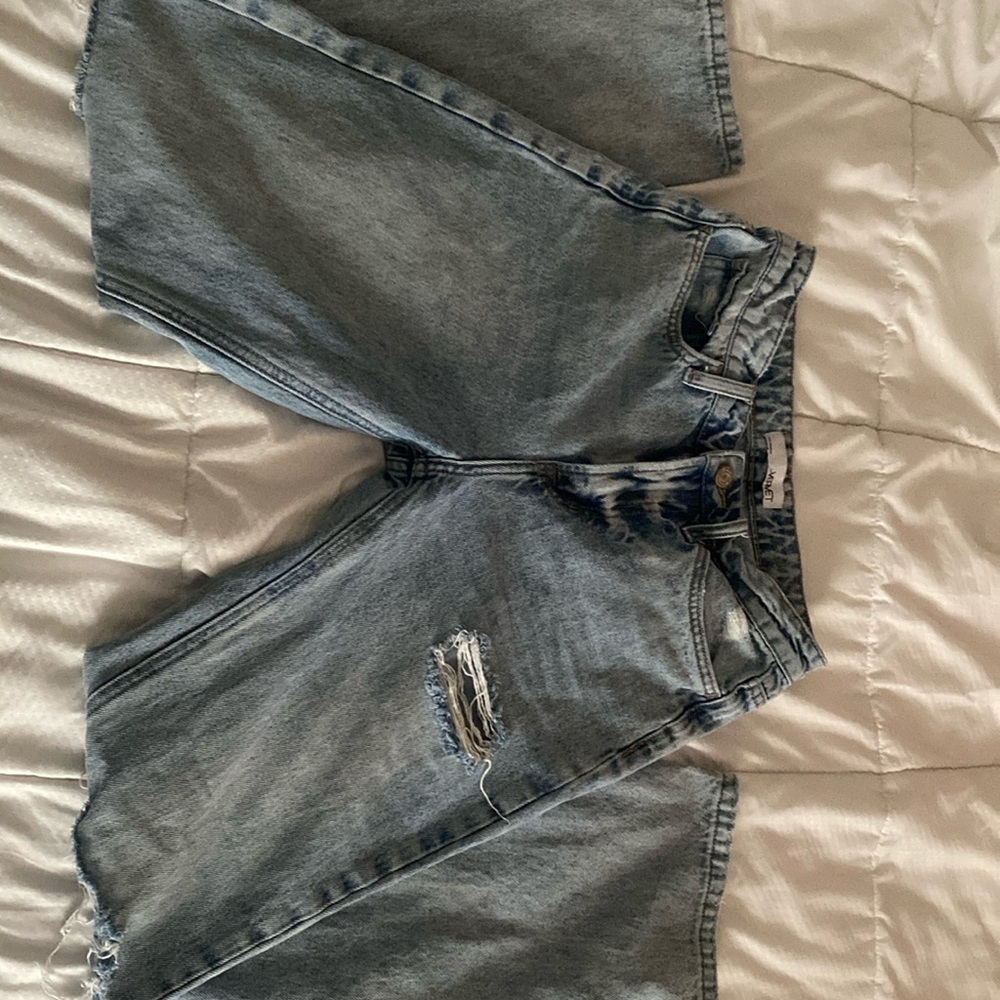 Ripped light wash straight legged jeans